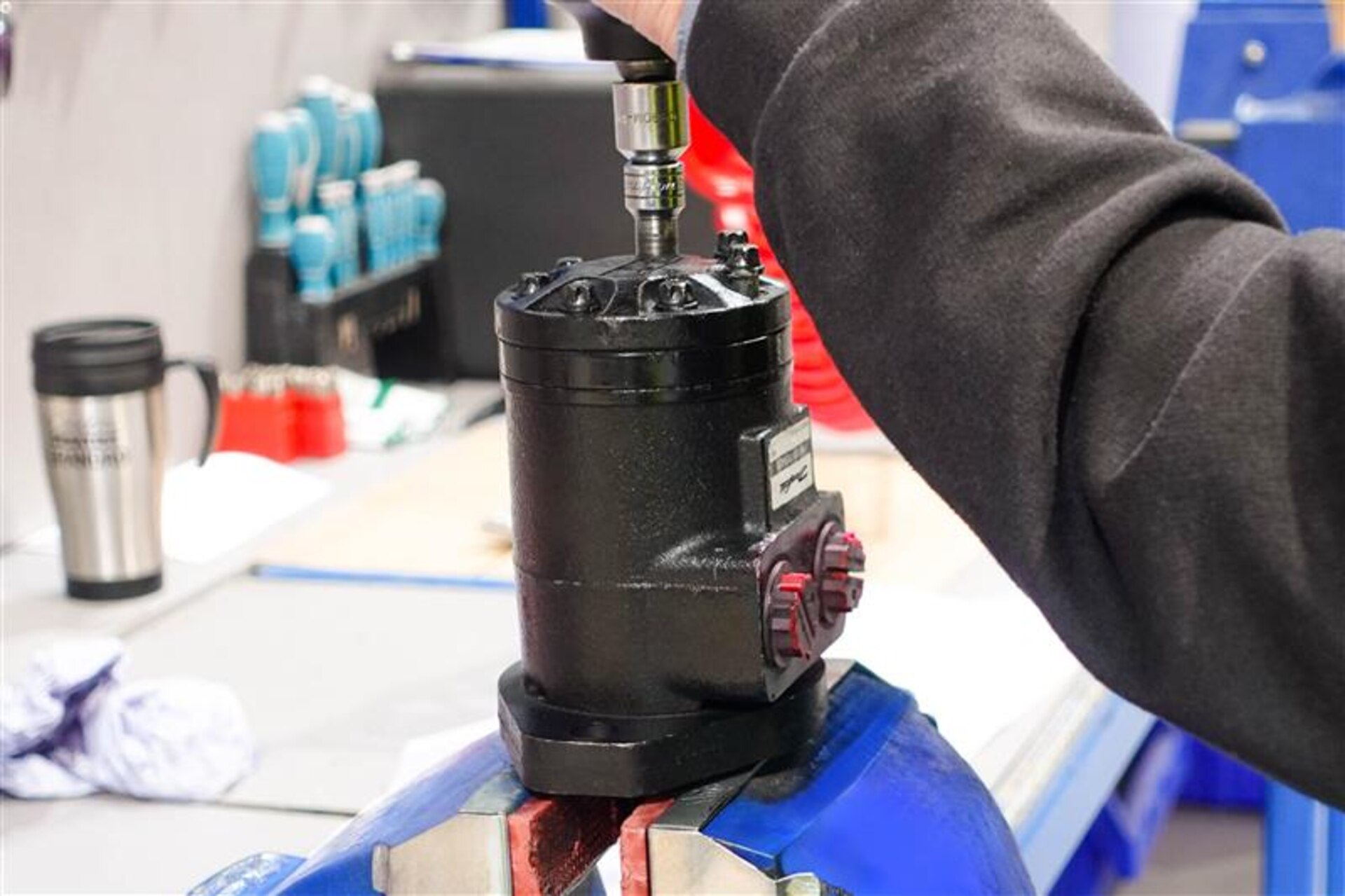 Flowtech engineer working on a black Danfoss motor