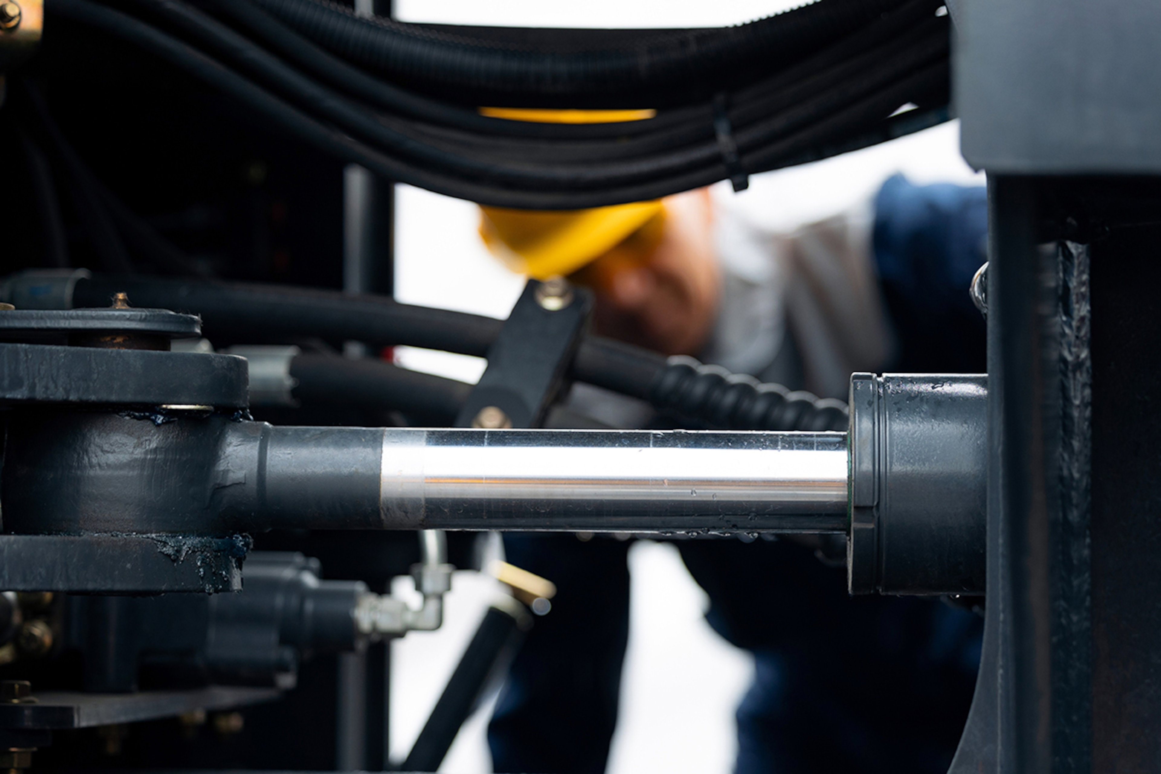 Flowtech engineer servicing a hydraulic cylinder