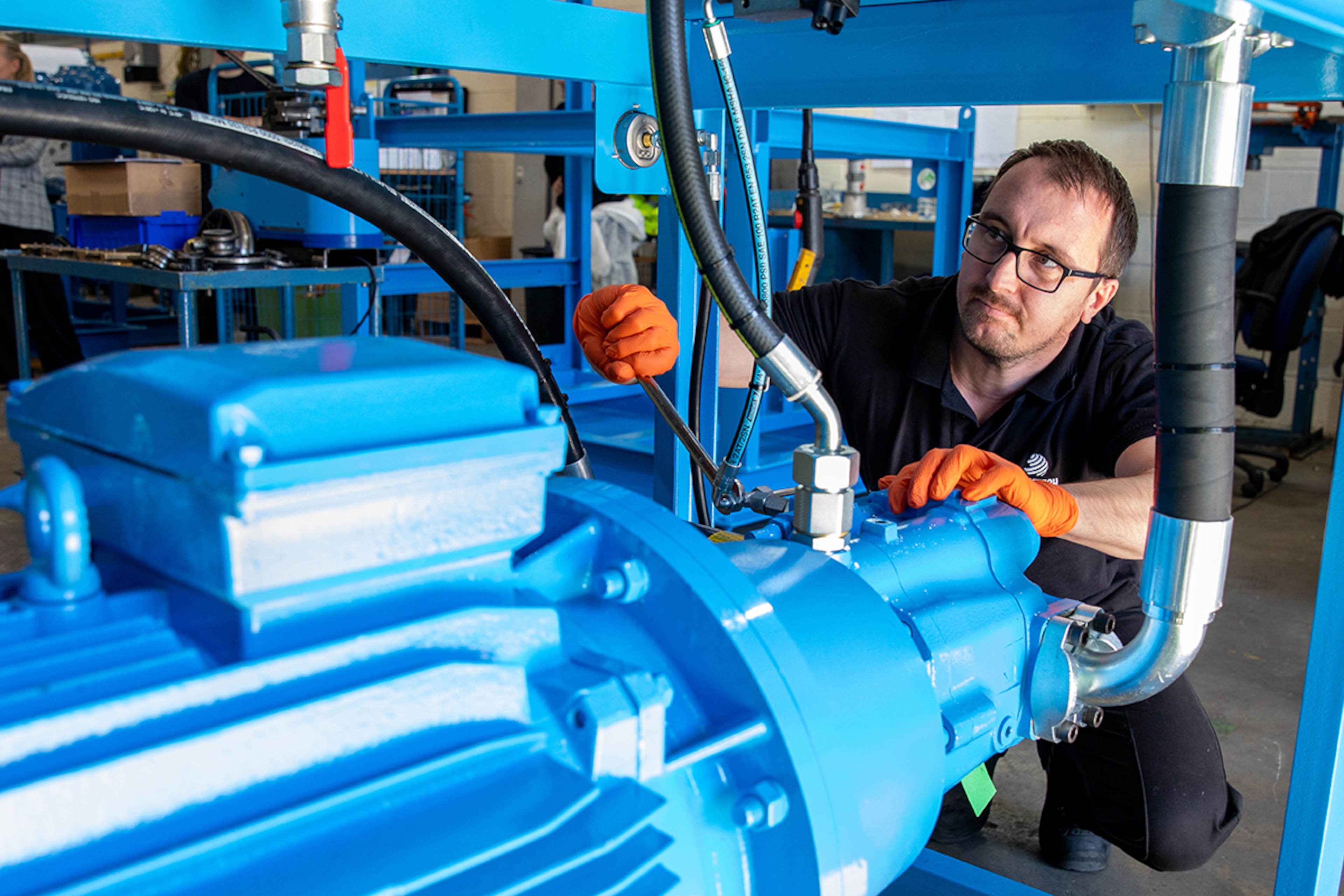 Man investigating blue power pack