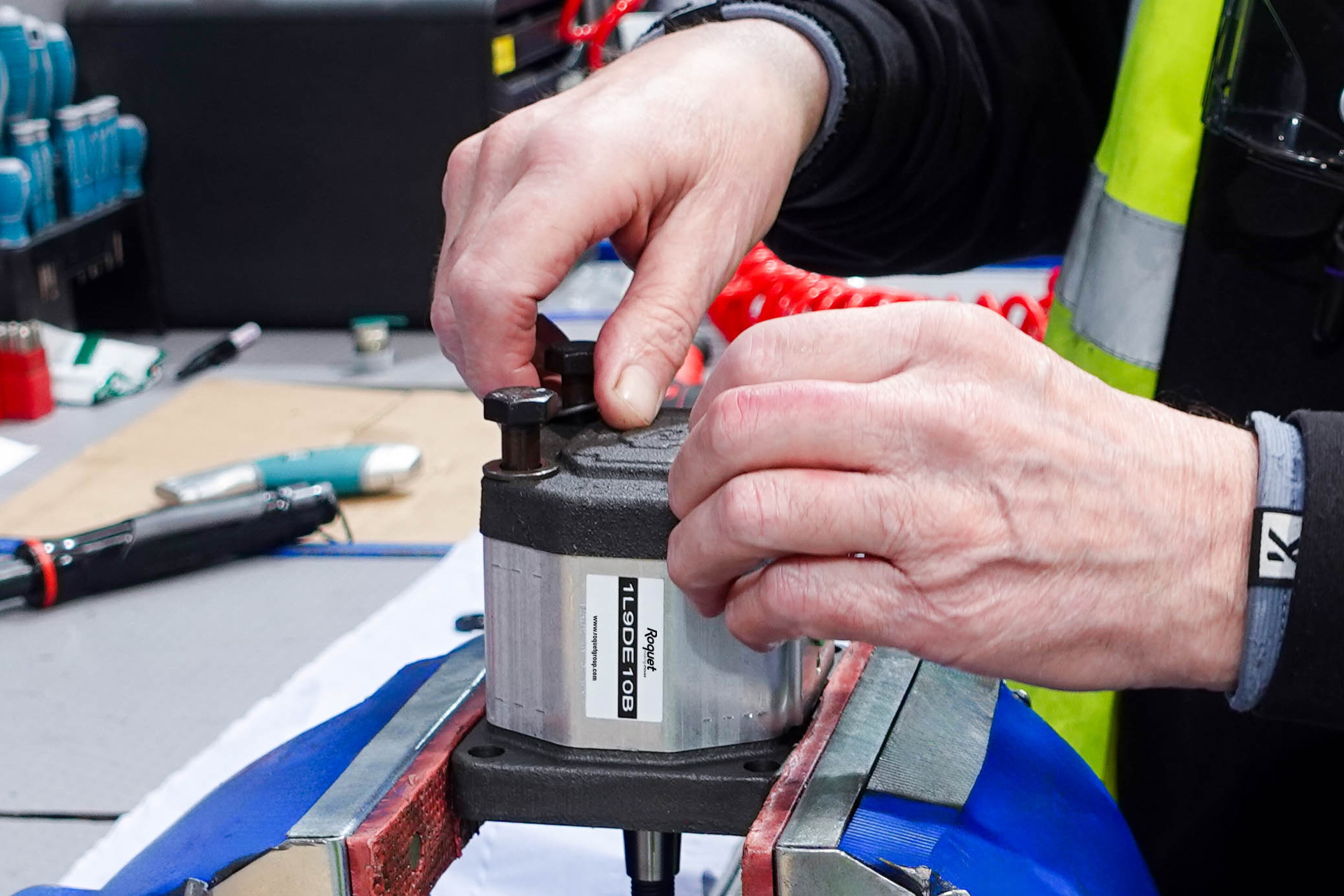 Engineer working on a pump in a workshop