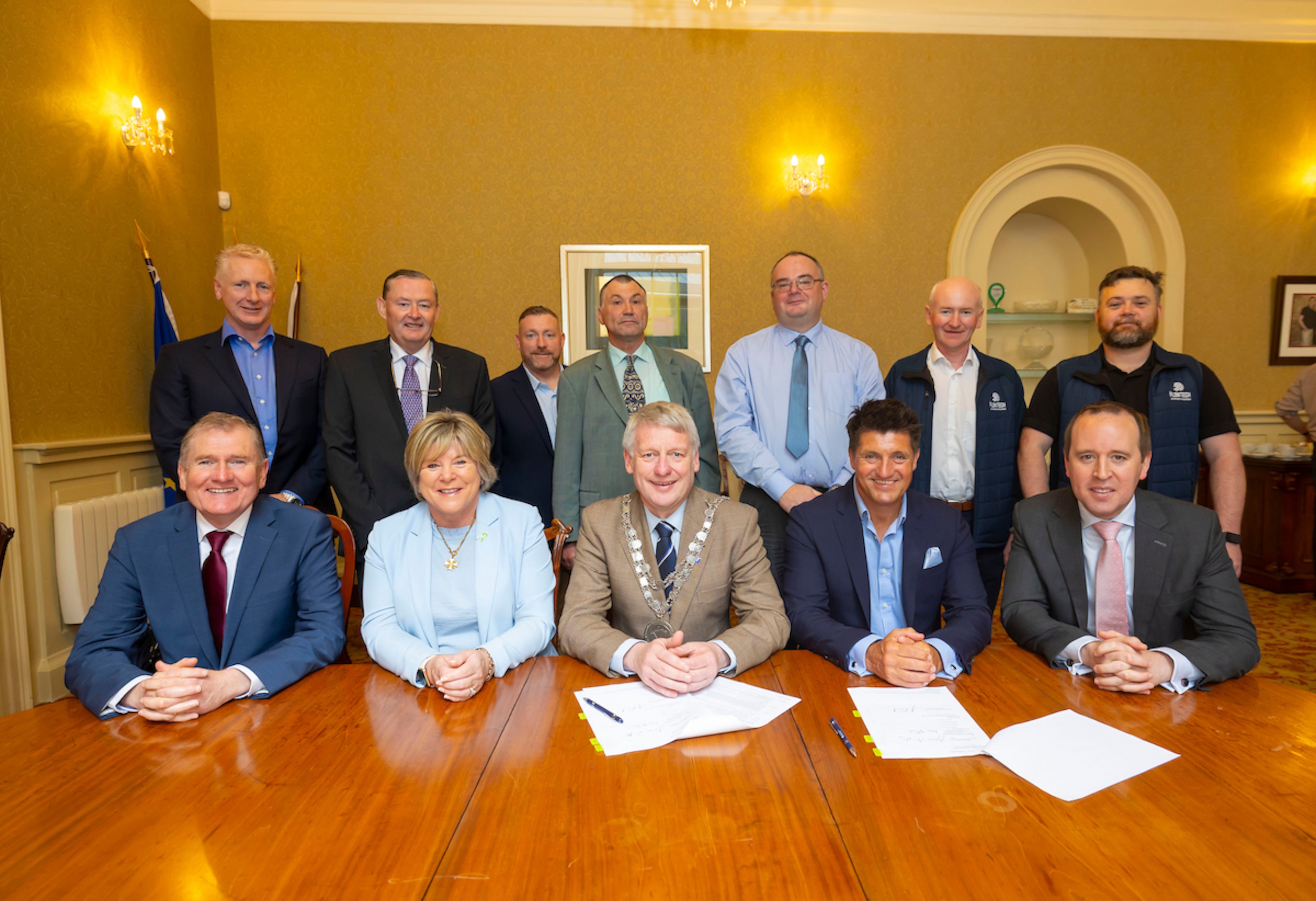 senior executives signing contract for rice bridge